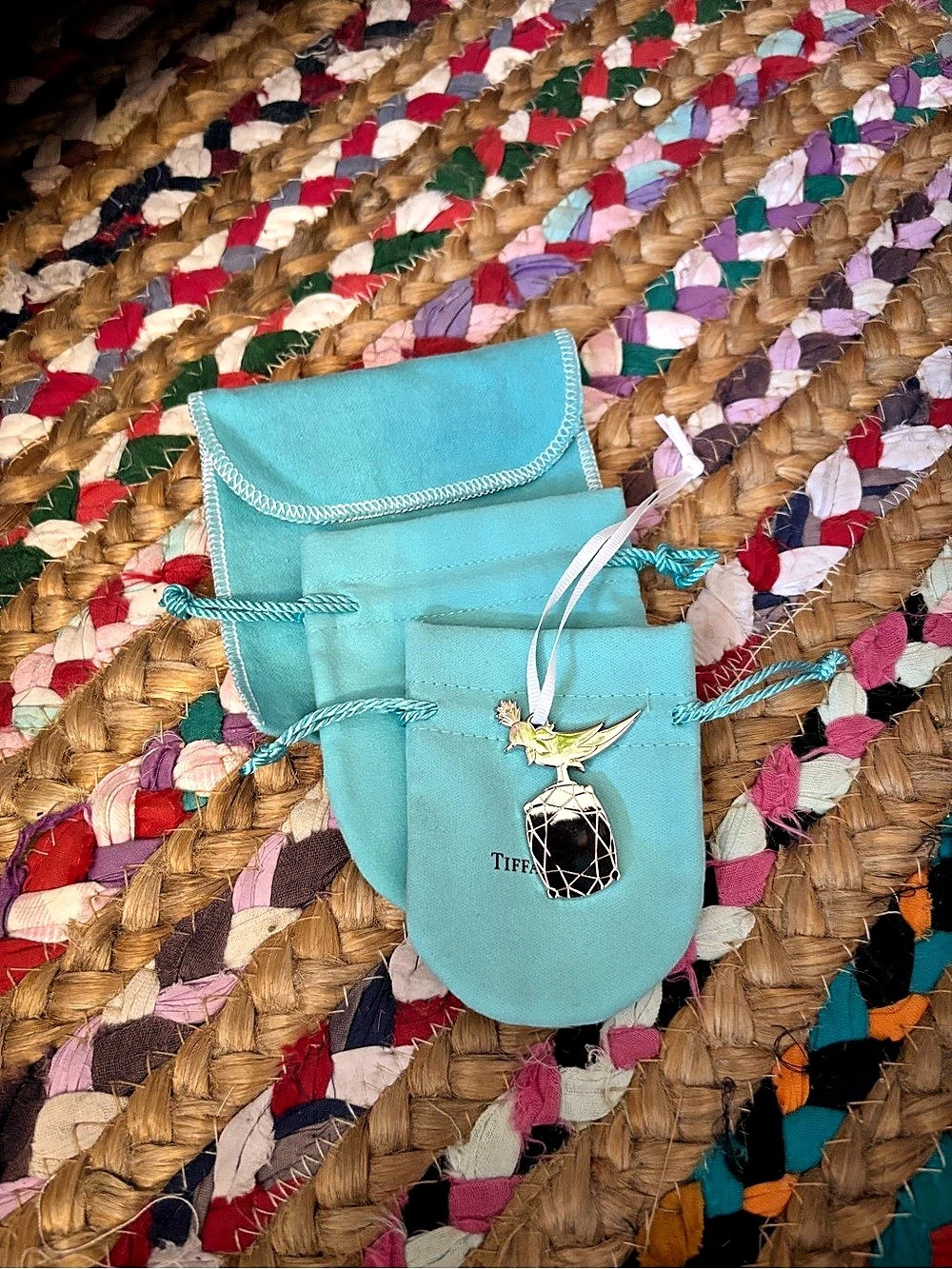 Tiffany Bird on a Rock Charm and pouches